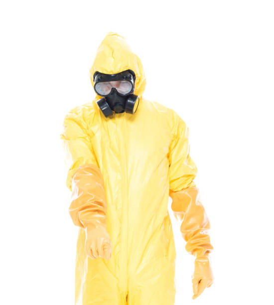 istock Man in protective clothing and pointing down 1151564741