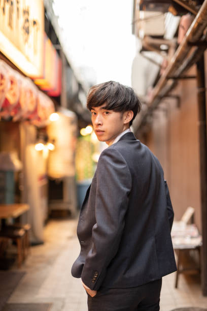 istock Young businessman walking into tavern 1151566664