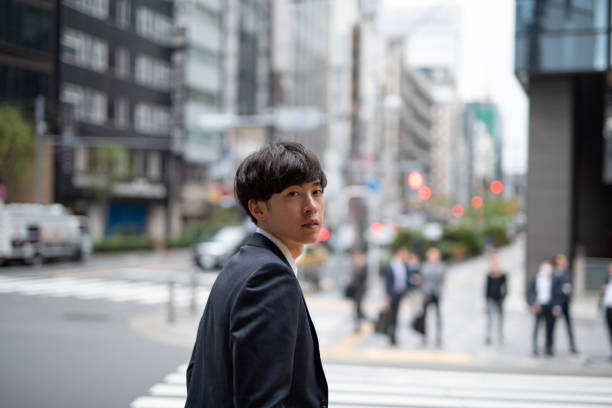 istock Young businessman walking on street 1151566984