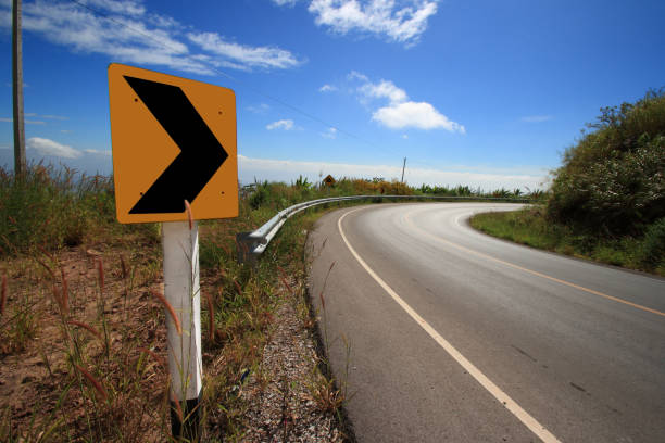 istock Curve road sign on down hill 1151569846