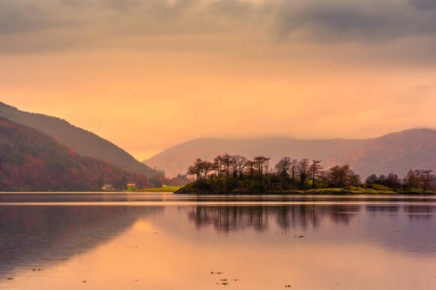 istock Loch leven at sunset, with mountains in the background 1151572896