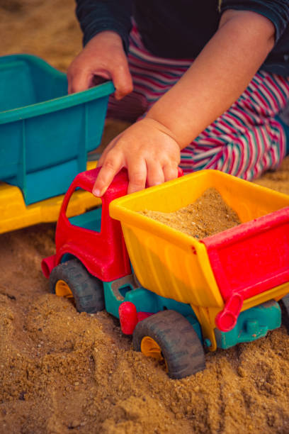 istock Child is playing in the sand 1151573710