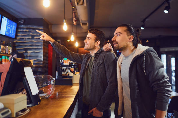 istock Friends choosing drink in bar 1151574823