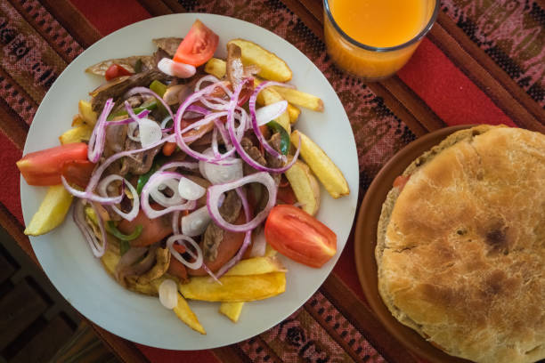 Typical dish of the Bolivian cuisine called pica pica, made with meat and fried potatoes and vegetables stock photo