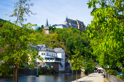 Aerial view of Marburg, Germany with stunning architecture, surrounded by lush greenery and a river valley.