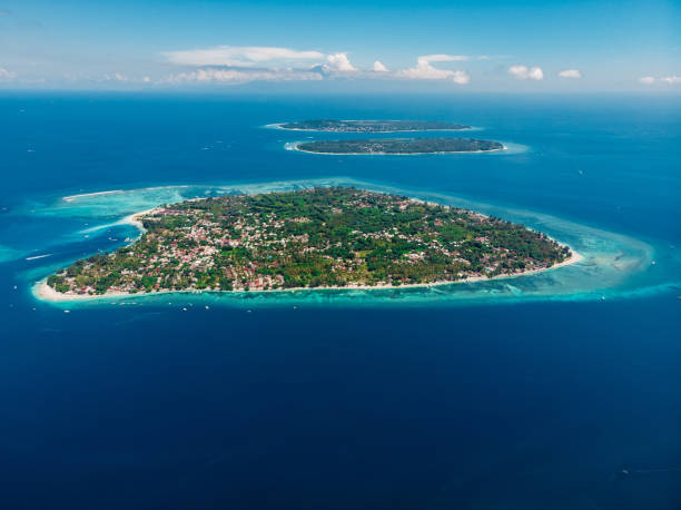 Aerial view with Gili islands and ocean, drone shot. Gili Air, Meno and Trawangan islands Aerial view with Gili islands and ocean, drone shot. Gili Air, Meno and Trawangan islands gili trawangan stock pictures, royalty-free photos & images