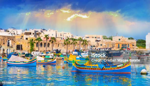 Marsaxlokk Village Harbor Of Malta At Sunset Stock Photo - Download Image Now - Marsaxlokk, Malta, Harbor