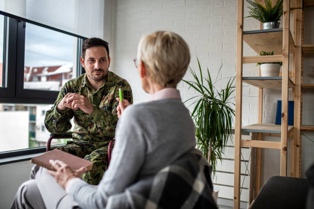 istock Depressed soldier and his psychotherapist during a session 1151588394