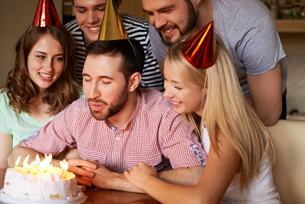 istock Content man celebrating birthday with friends 1151589442
