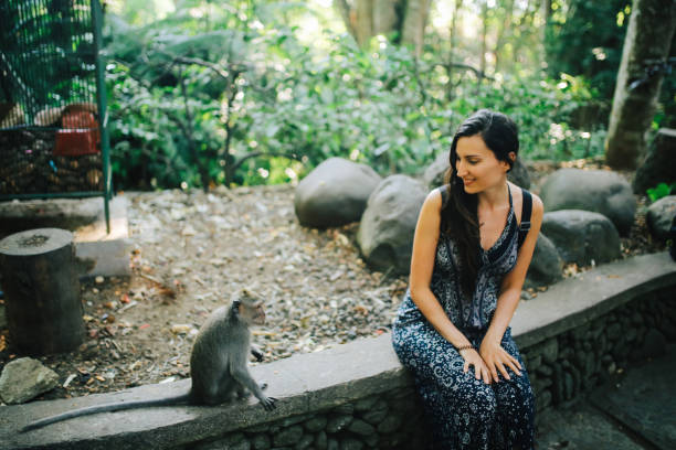 istock Young woman in Ubud Monkey Forest, Bali, Indonesia 1151589665