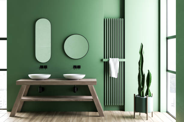 istock Green bathroom interior with double sink 1151592231