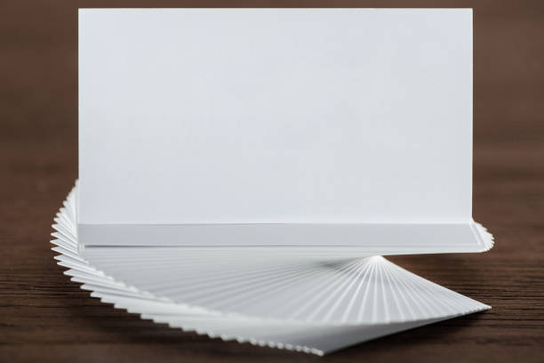 istock close up of empty and blank card on wooden table with copy space 1151592404