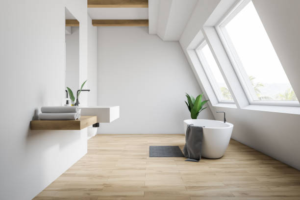 istock Attic white bathroom interior, tub and sink 1151592550