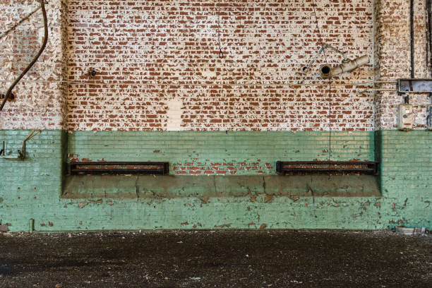 istock Painted brick wall in abandoned factory 1151594375