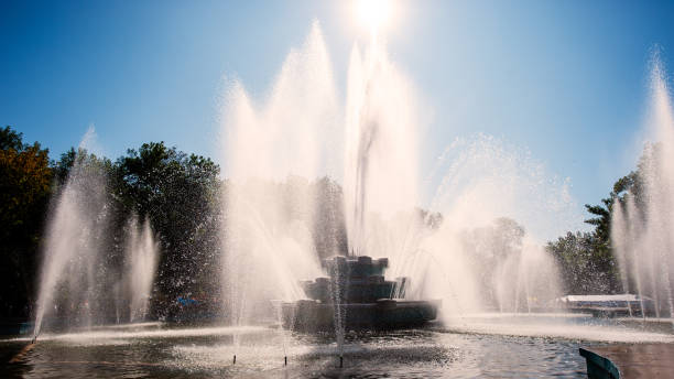istock fountain in the city park, hot day. 1151597582