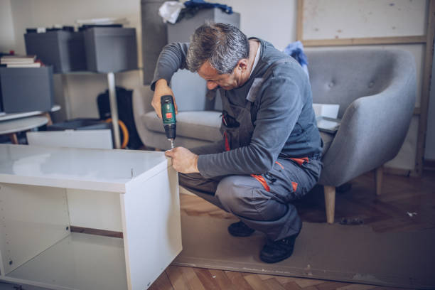 istock Senior handyman assembling wooden furniture 1151597977