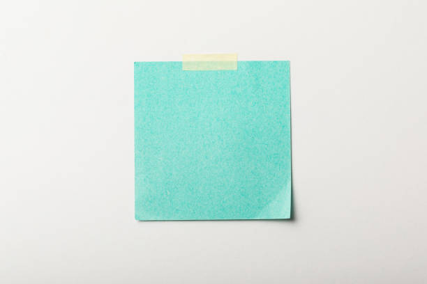 istock turquoise blank sticker with sticky tape on white background 1151599285