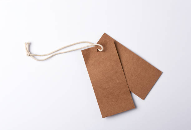 istock empty paper brown tag on the rope, white background 1151601991