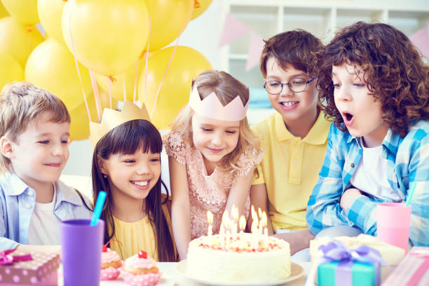 istock Excited kids with birthday cake 1151602602
