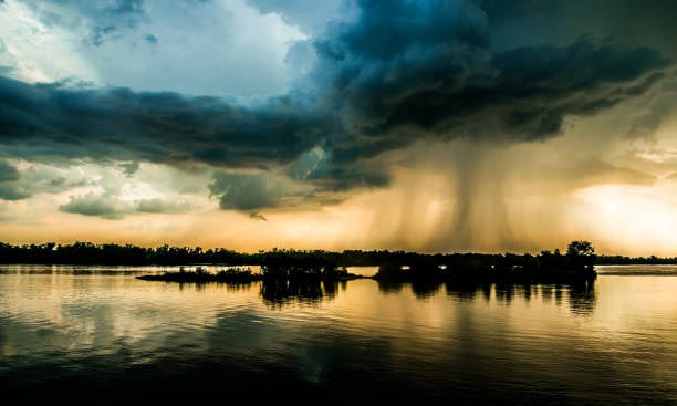 hurricane over louisiana. storm clouds and rain over the mississippi - mississippi river imagens e fotografias de stock