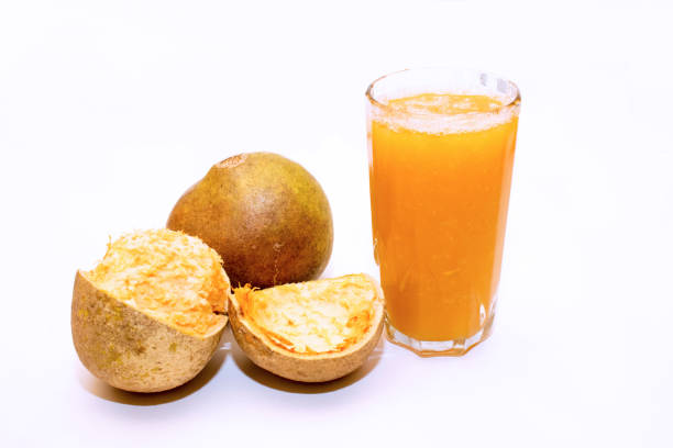 istock image of bael fruit juice with white background 1151602958