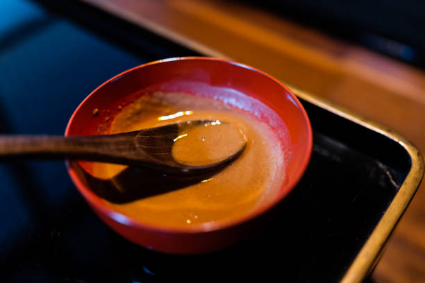 traditional japanese bowl in restaurant with black lacquered wood table background and miso sauce and spoon - 13571 imagens e fotografias de stock