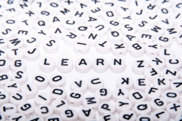 istock Learn word written with buttons/dice with black text written on top close up shot 1151605537