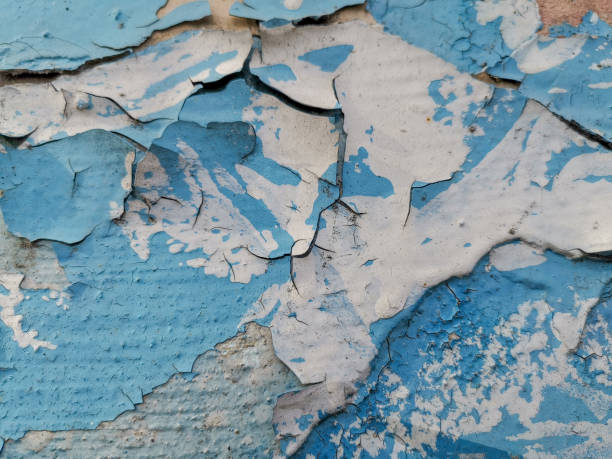 istock Blue background with cracked oil paint on plaster. 1151605795