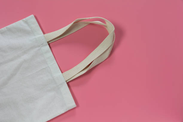 istock White tote bag canvas fabric. Cloth shopping sack mockup with copy space. 1151605927