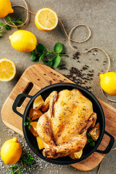 istock top view of fried chicken in griddle pan with lemons and greenery 1151607938