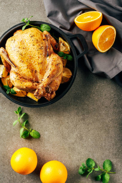 istock top view of fried chicken in griddle pan with oranges, greenery and cloth 1151607950