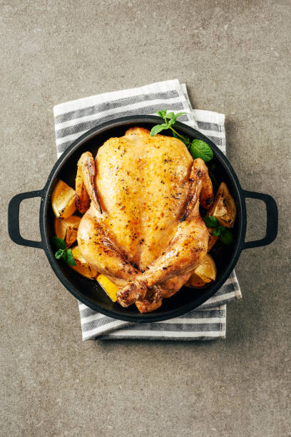 istock top view of fried chicken in griddle pan with lemons and greenery on cloth 1151607958