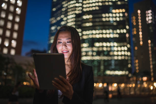 istock Businesswoman working on digital tablet at night 1151613746