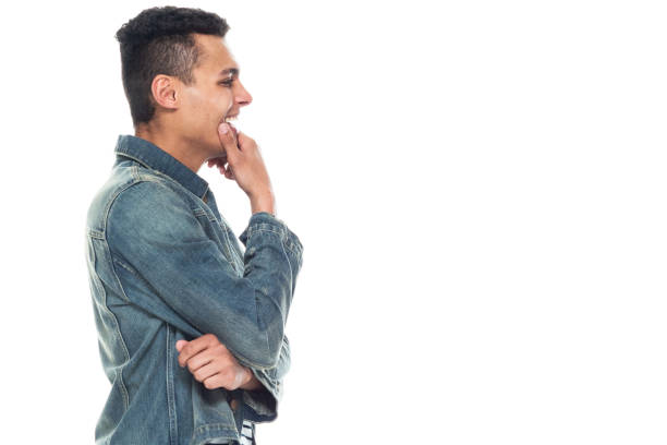 istock Good looking tall black man wearing denim jacket - is thinking 1151614070