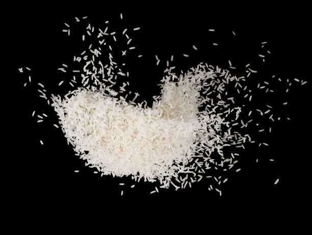 istock Stop motion white rice splash explosion isolated on black background food object design 1151617430