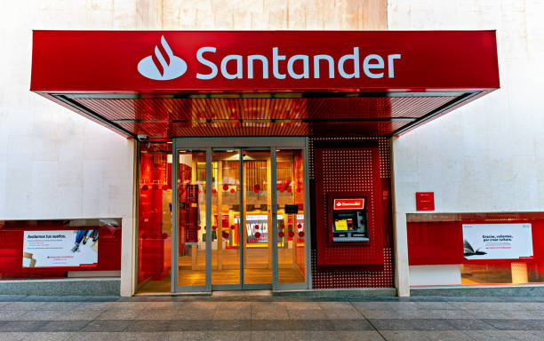 entrance to bank santander office in almeria, spain. - santander imagens e fotografias de stock