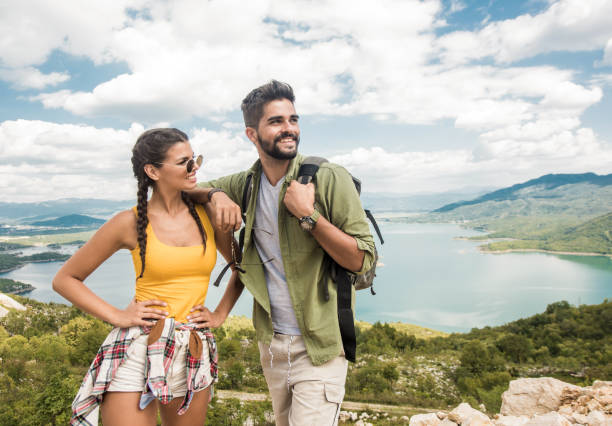 istock Happy young couple hiking together. 1151621509
