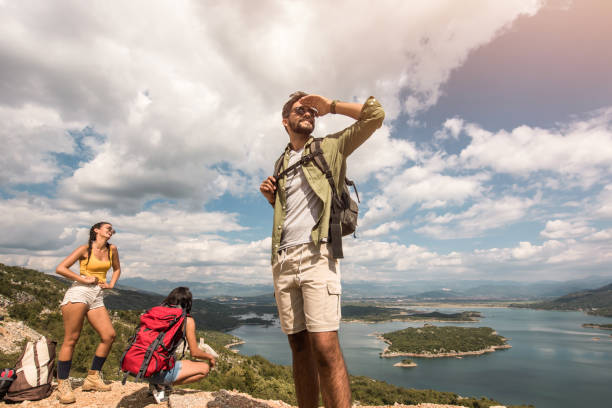 istock Three happy young friends hiking together. 1151626240