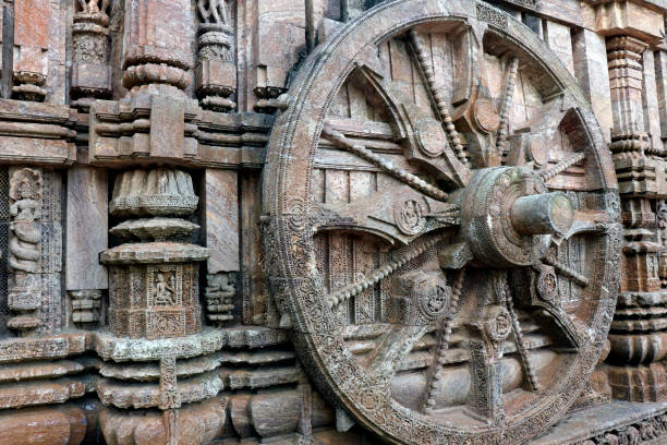 Ancient chariot Wheel, Konark Sun Temple, Orissa. Ancient chariot Wheel, Konark Sun Temple, Orissa. The temple is assigned to king Narasingha deva I. Konark Sun Temple is a 13th-century temple at Konark about 35 km from Puri of Odisha, India. 
     This temple dedicated to the Hindu god "Surya". Sun Temple also known as the Black Pagoda. The entire temple has been conceived as a chariot of the sun god with 24 wheels, dragged by 7 horses. chariot wheel at konark sun temple india stock pictures, royalty-free photos & images