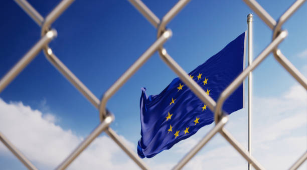 istock Fence In Front Of European Union Flag 1151631507