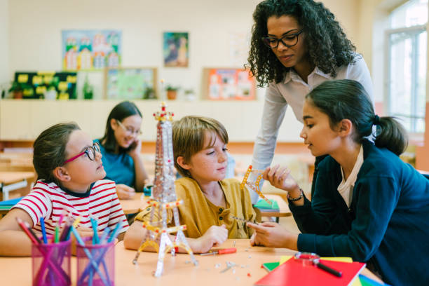 istock School children with mixed race teacher in class 1151631956