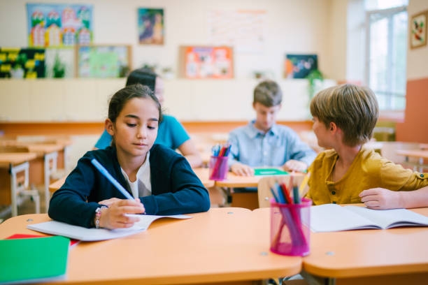 istock Kids studying in the classroom 1151631997