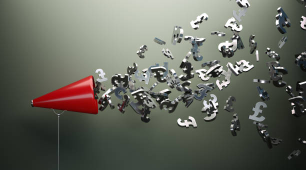 istock Red Megaphone And Silver British Pound Symbols In Front Of Gray Wall 1151632945