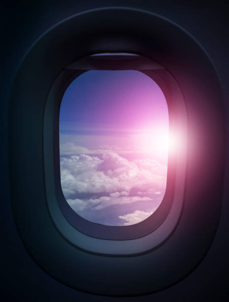 istock Airplane window. View from airplane to beautiful sky and clouds. 1151633742