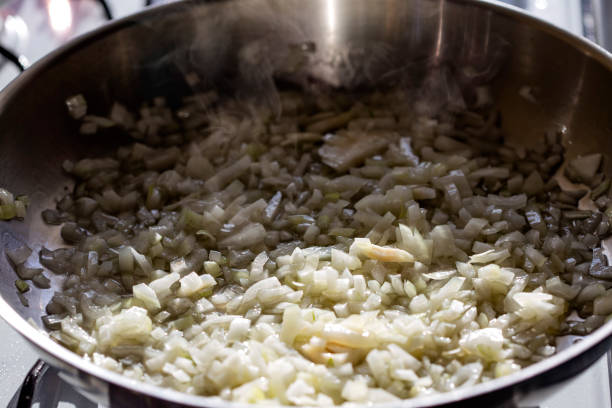 istock Frying chopped onion in pan 1151639303