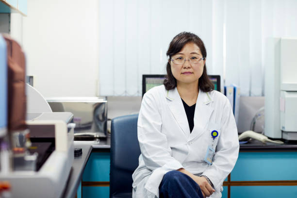 istock Confident female researcher sitting on chair 1151640432