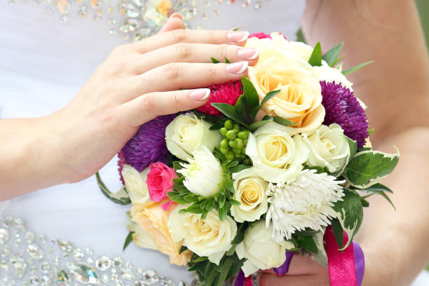 istock bride holding wedding bouquet closeup 1151645490