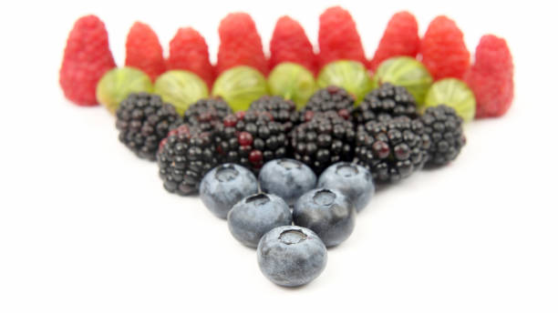 istock raspberries, gooseberries, blackberries and blueberries on white background 1151648386