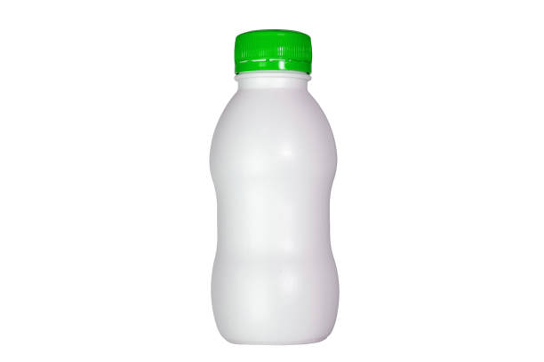 istock Isolated white plastic yogurt bottle with green lid 1151649947