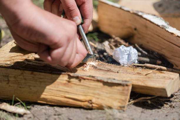 istock A pair of hands making a fire with flint and steel 1151655029
